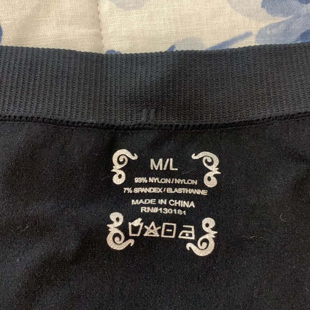 Black tights with button accents on ankle. Size M/L